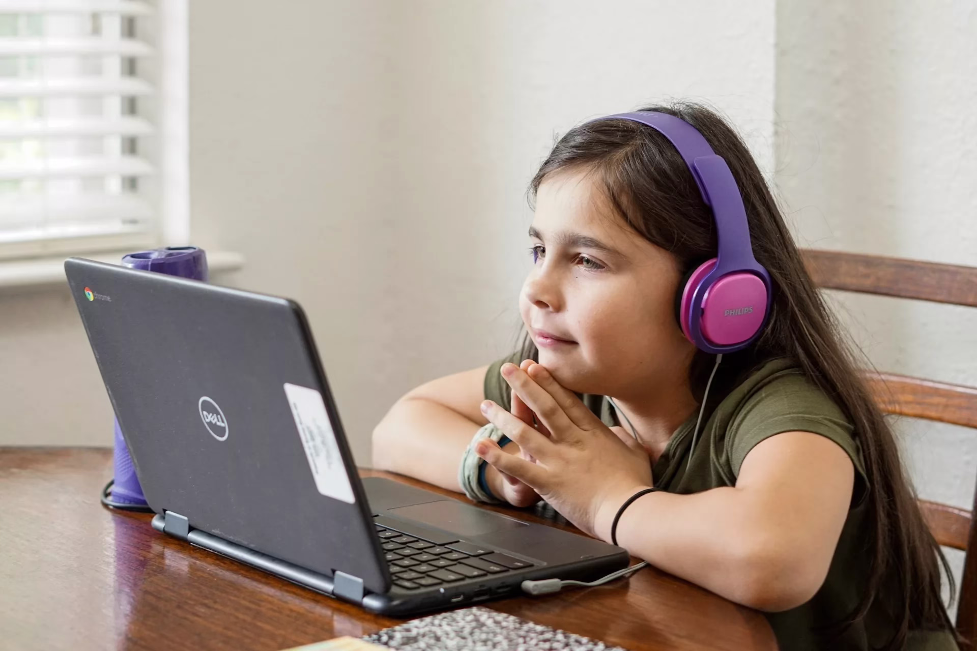 Tips for Parents About Social Media Fashion A girl using the computer finding tips on fashion on social media.